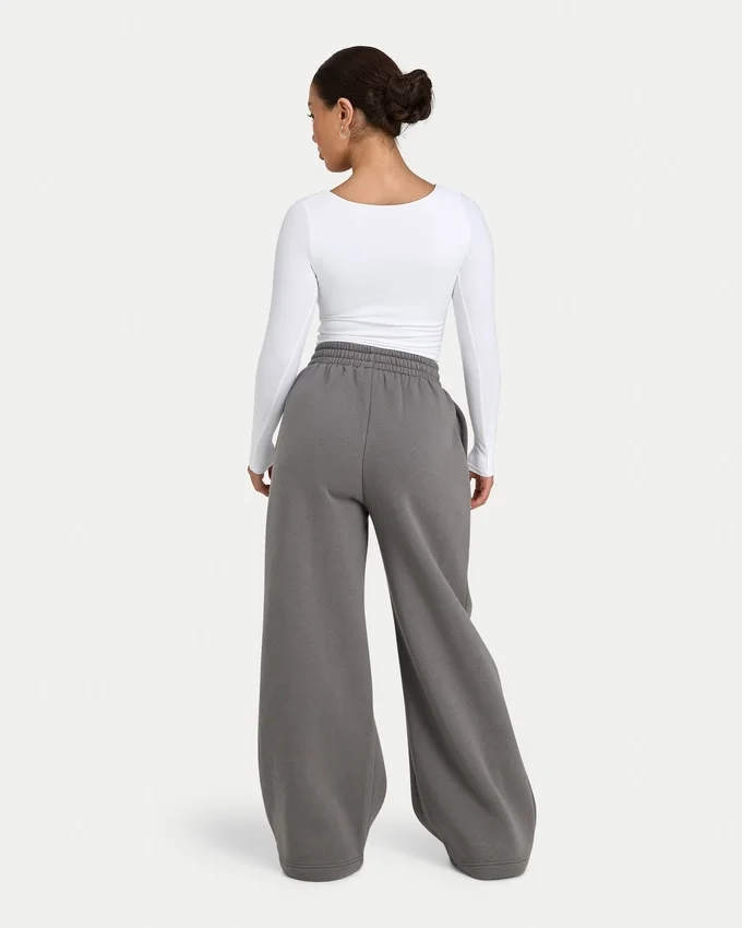 Pantalones de chándal de mujer de corte ancho «Collective» – gris carbón Pantalones de chándal de mujer de corte ancho «Collective» – gris carbón