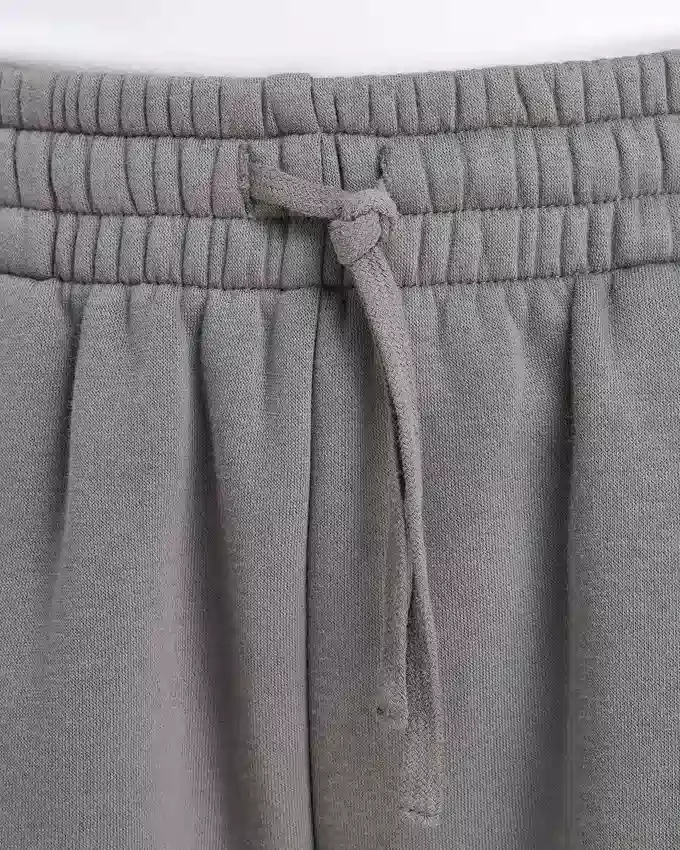 Pantalones de chándal de mujer de corte ancho «Collective» – gris carbón Pantalones de chándal de mujer de corte ancho «Collective» – gris carbón